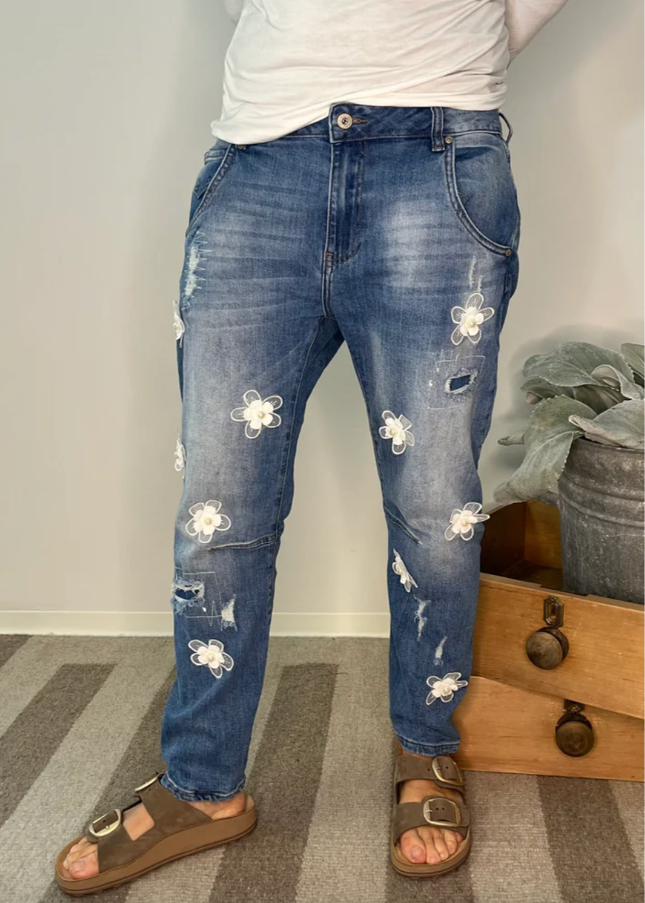 Denimbukser med blomster