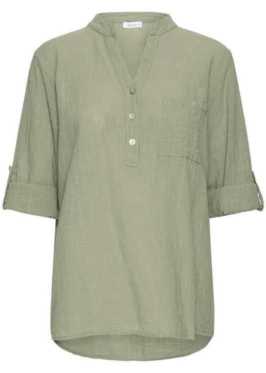 Grønn bluse med knapper